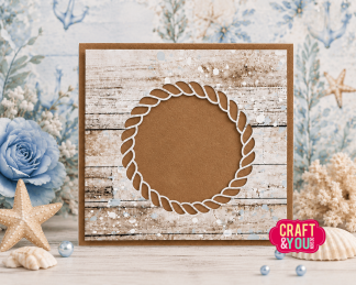 Decorative craft card: brown circular rope motif on distressed white wood, surrounded by seashells and blue flowers, Craft & You logo bottom right. (Product shot)