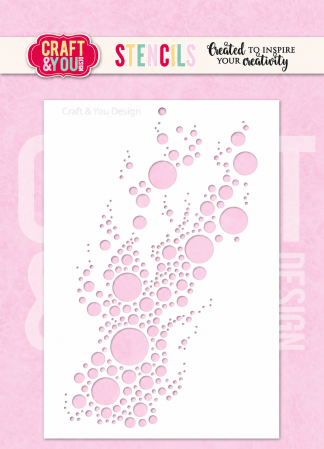 White sheet displaying a diagonal cluster of pink circles of various sizes on a pink background, a decorative stencil pattern.